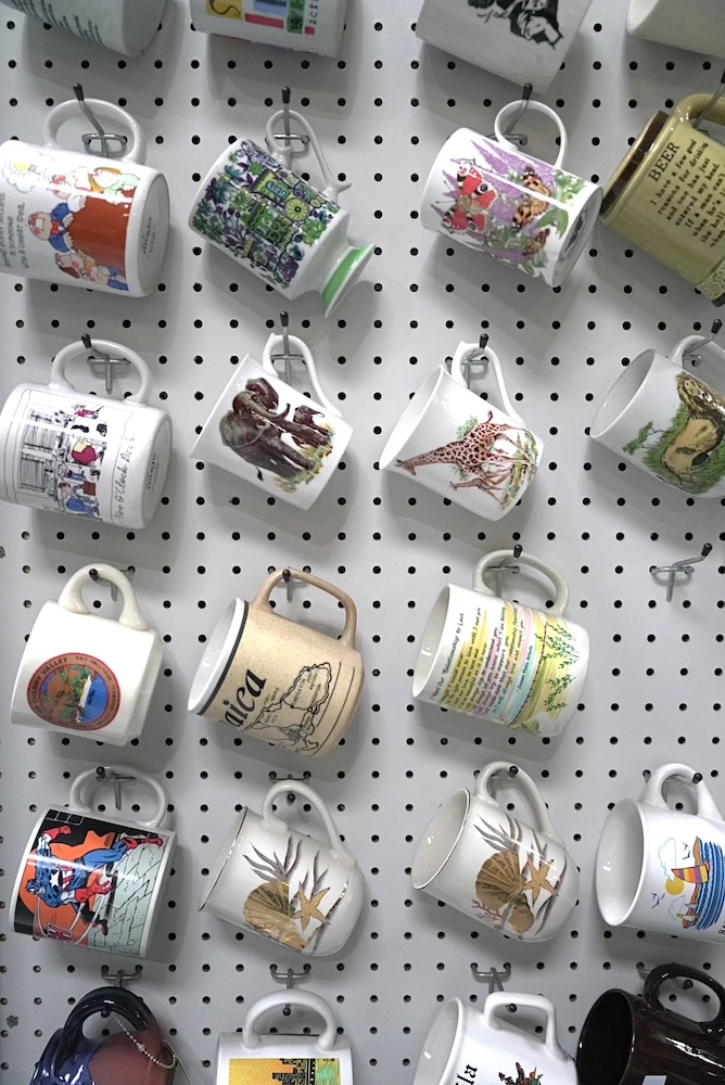 Wall of unique mugs hanging