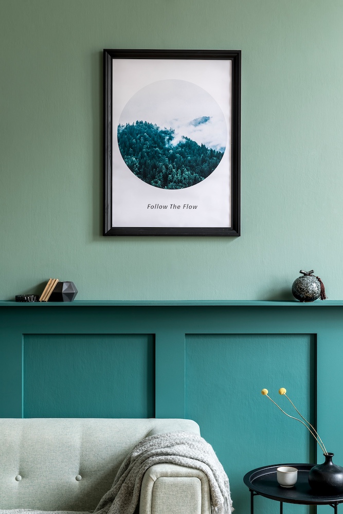 Photo hanging on teal wall