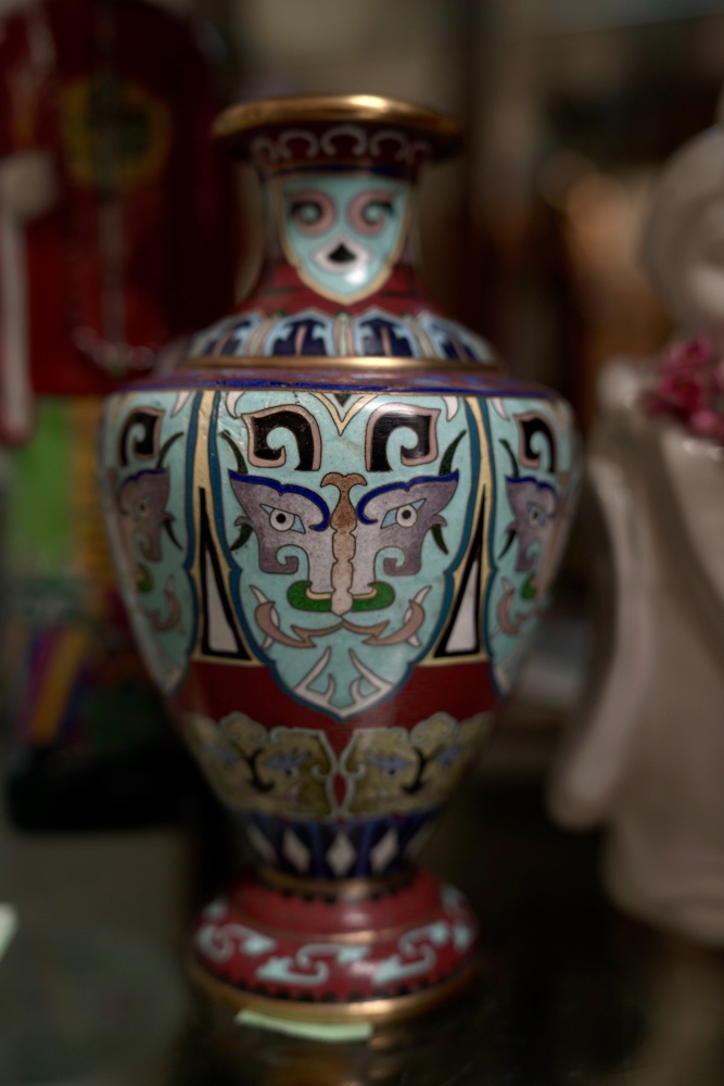 Intricate painted metal vase at Encinitas Decor Store.